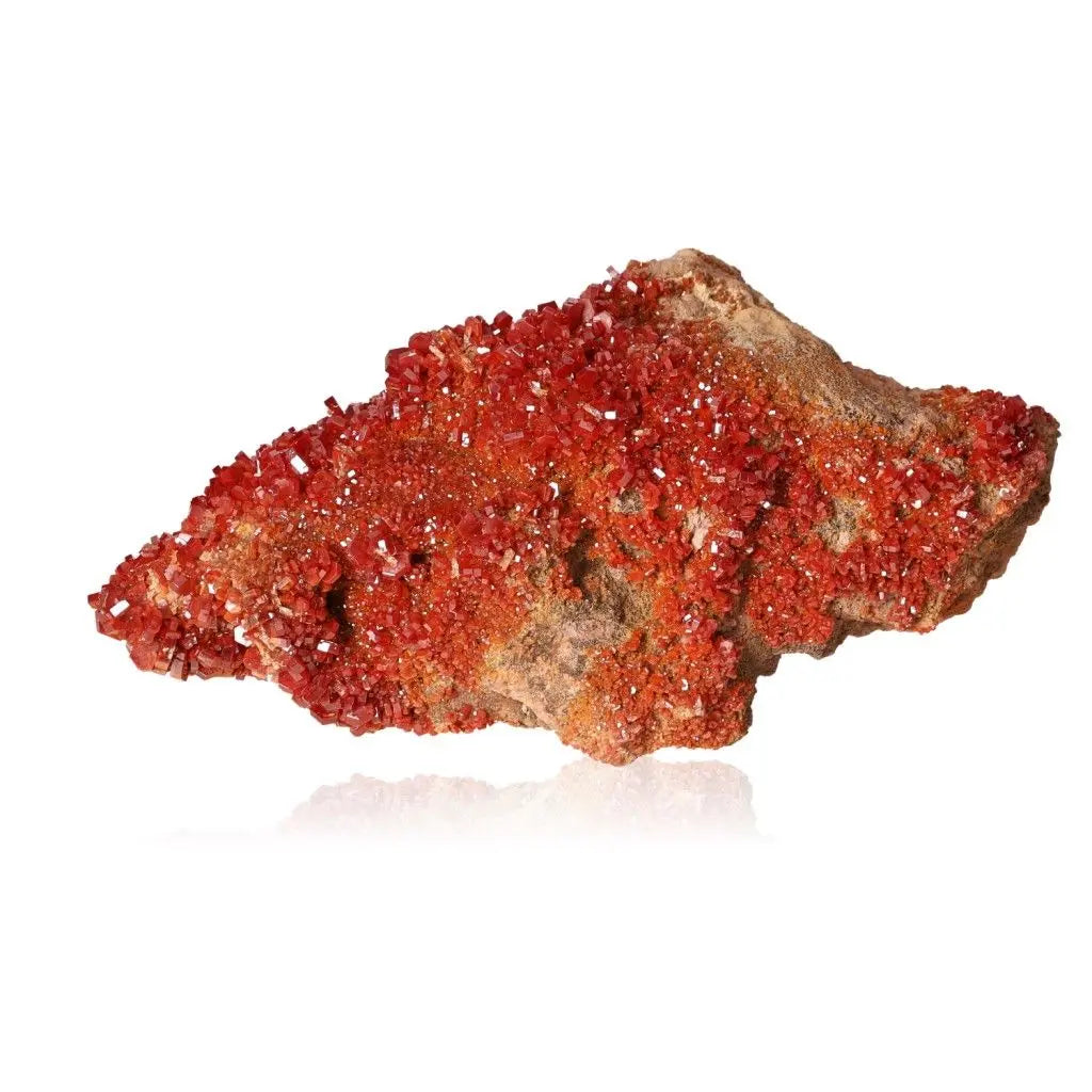 Vanadinite druzy showcasing vibrant red-orange hues, ideal for collectors and creatives seeking focus and energy.