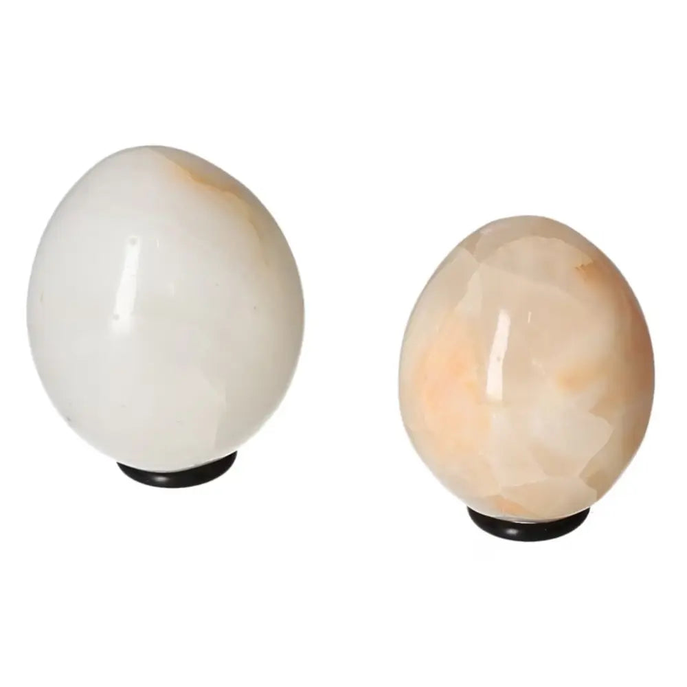 White Onyx Egg for strength and self-discipline, aids in overcoming challenges and releasing past burdens. Onyx gemstone for empowerment.