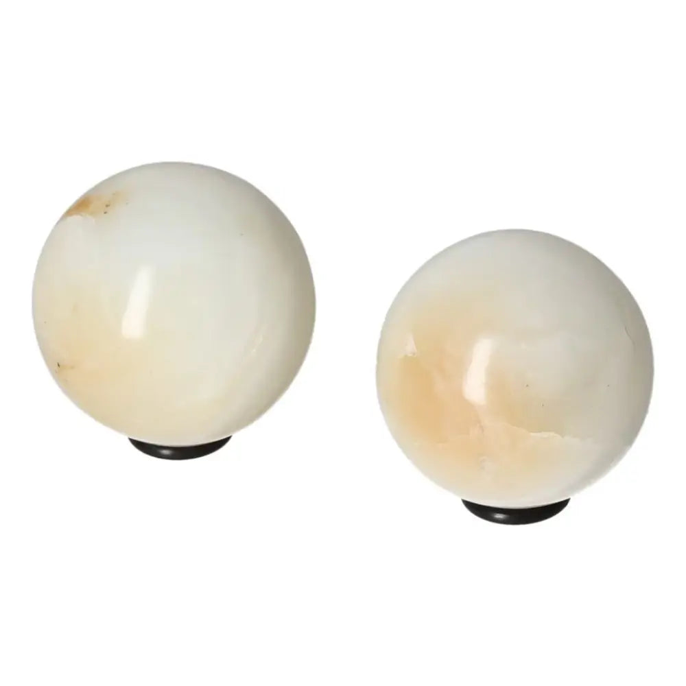 White Onyx Sphere enhancing strength, determination, and self-discipline, helping to overcome challenges and release past burdens.