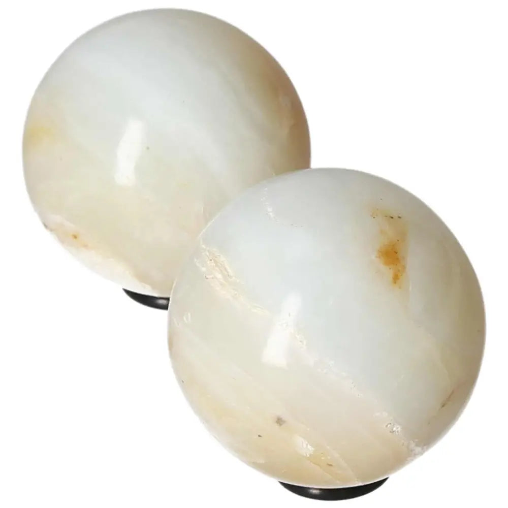 White Onyx Spheres for resilience and self-discipline, aiding in overcoming challenges and releasing past burdens.