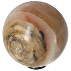 White Onyx Sphere, enhances determination and self-discipline, promotes control and releases past burdens.