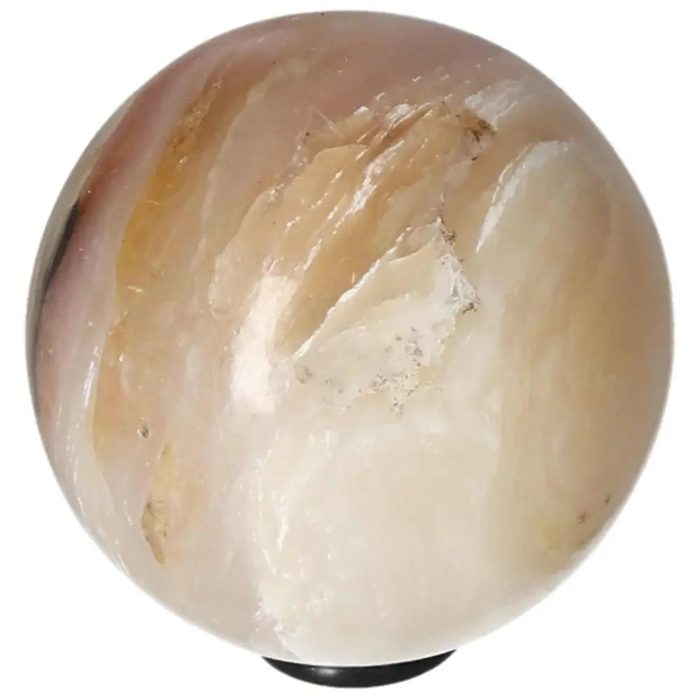 White Onyx Sphere enhancing determination, strength, and self-discipline.