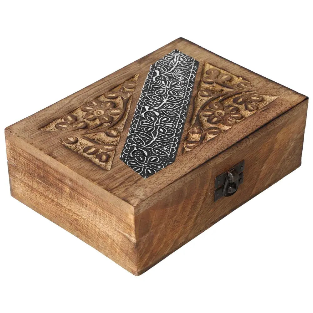 Handcrafted wooden jewelry box with intricate carvings, blending luxury with spiritual elegance by Sylvia Crystals.