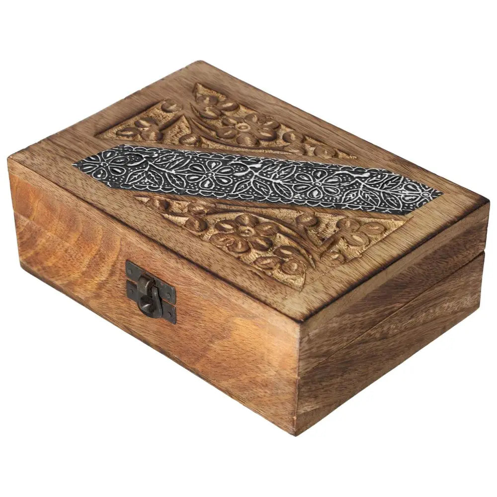 Elegant wooden jewelry box with intricate carvings and decorative latch, embodying luxury and spiritual connection.