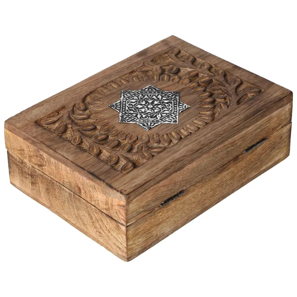 Elegant wooden jewelry box with intricate carvings, embodying luxury and conscious design by Sylvia Crystals, ideal for treasured pieces.