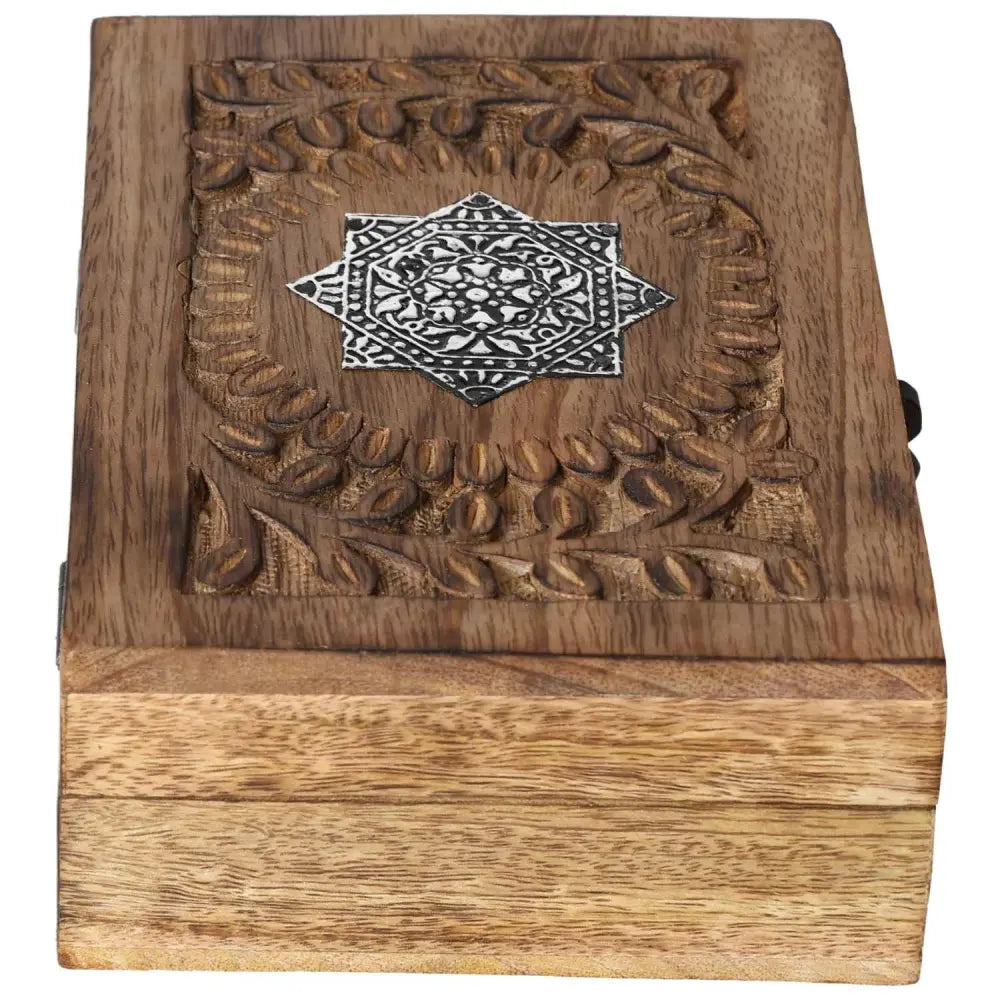 Exquisite wooden jewelry box with ornate carved design, crafted by Sylvia Crystals, showcasing luxury and elegance for treasured items.