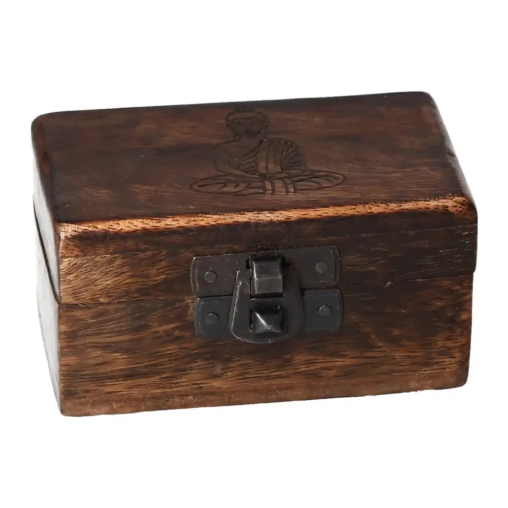 Handcrafted wooden pill box with carving, 9x5x4cm, displaying a closed latch and an etched design on the lid, ideal for storing small items.