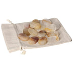 Yellow Hematoide crystals on a cloth bag, ideal for stress relief and grounding therapy.
