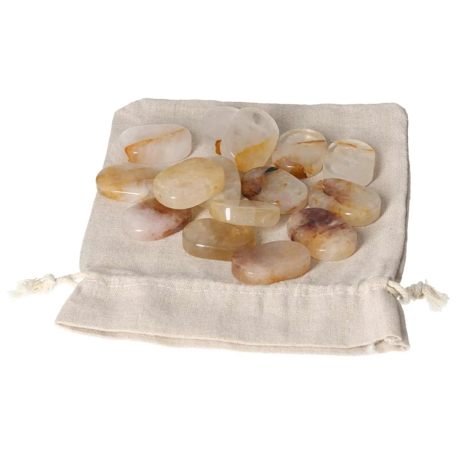 Yellow Hematoide crystal thumb massagers on fabric pouch, designed for stress relief and grounding relaxation.