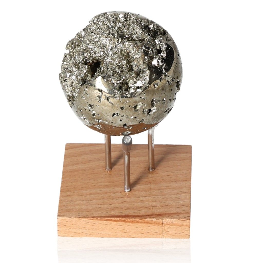 Pyrite sphere on wooden stand, promoting independence, courage, and goal achievement through mental and material support.