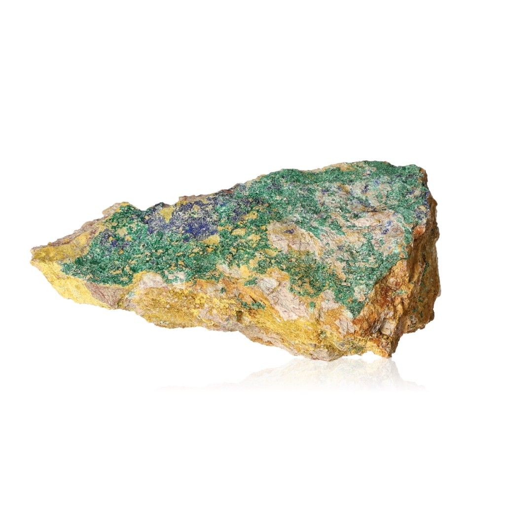 Raw malachite stone with vibrant green and yellow patterns on a white background.