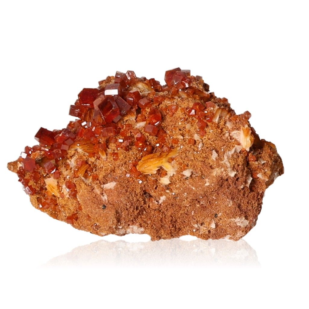 Vanadinite druze with vibrant reddish-brown hexagonal crystals on a rocky base, enhancing focus and motivation.