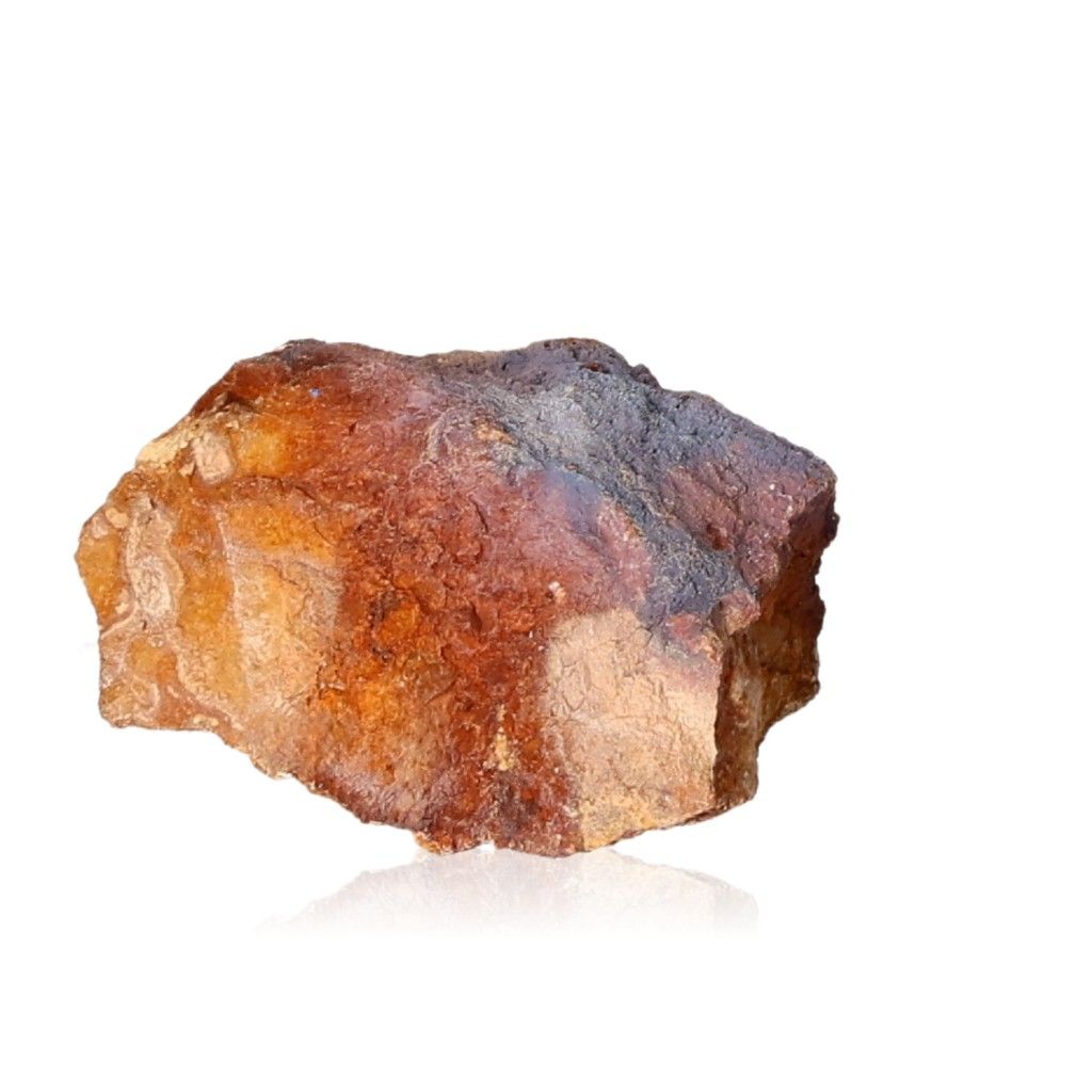 Raw brown and amber mineral rock on a white background.