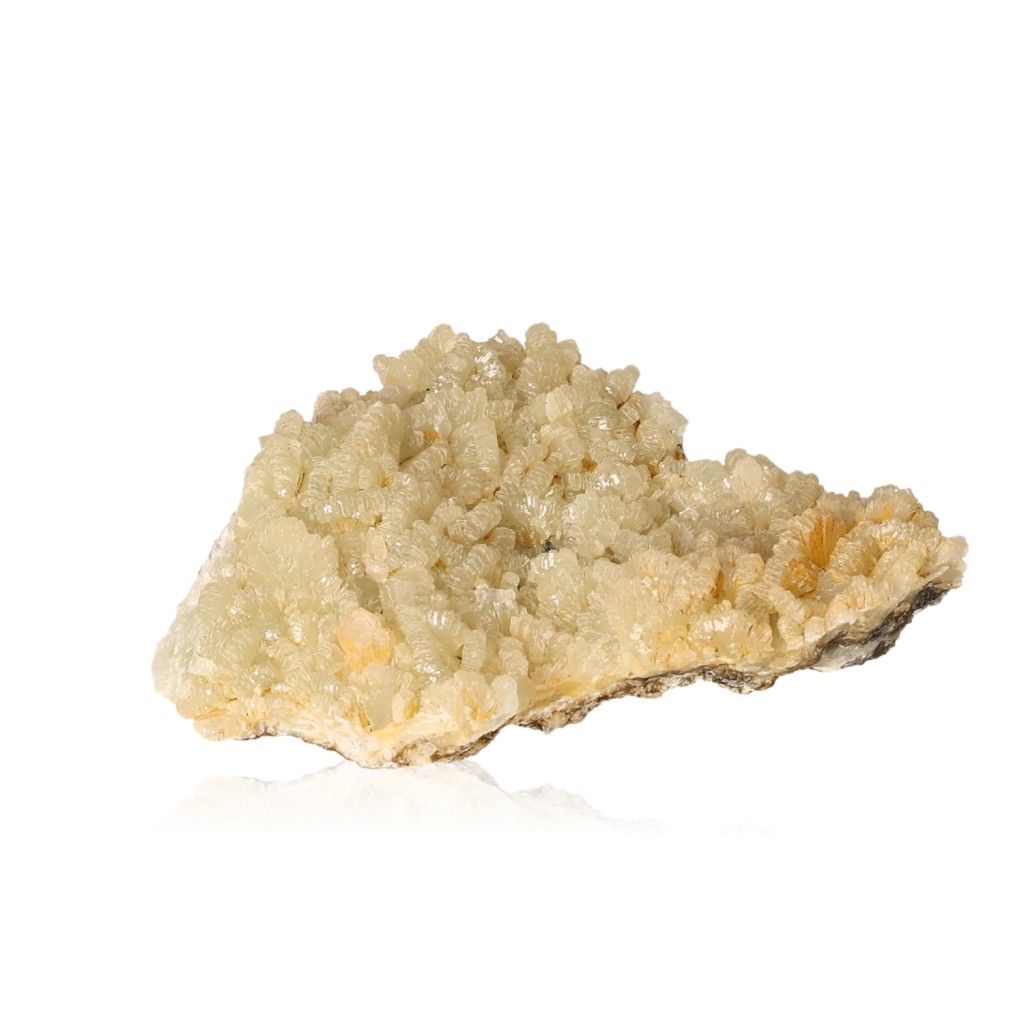 Prehnite druzy crystal with pale yellowish-green hues, promoting inner peace and spiritual growth, isolated on a white background.