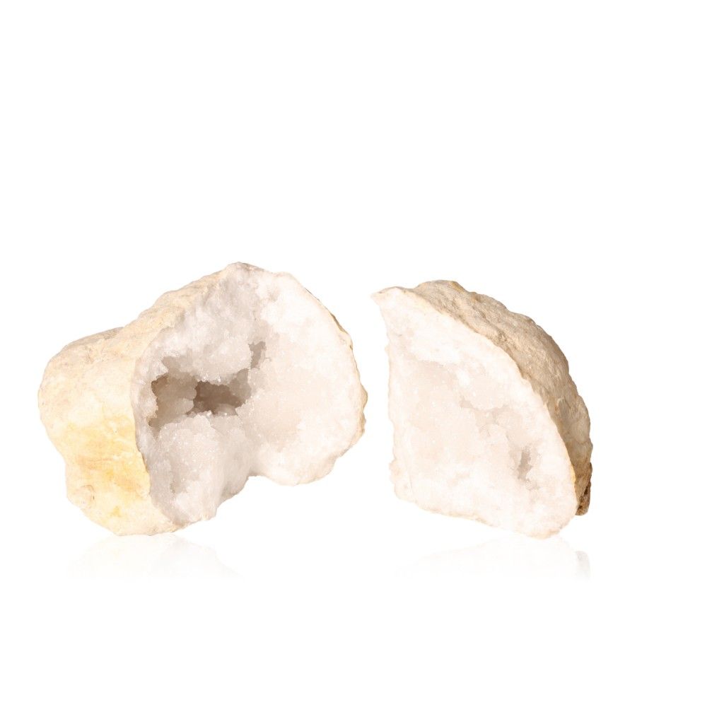 Quartz geode with milky white crystals, showcasing rugged exterior and sparkling interior, ideal for energy cleansing and focus.