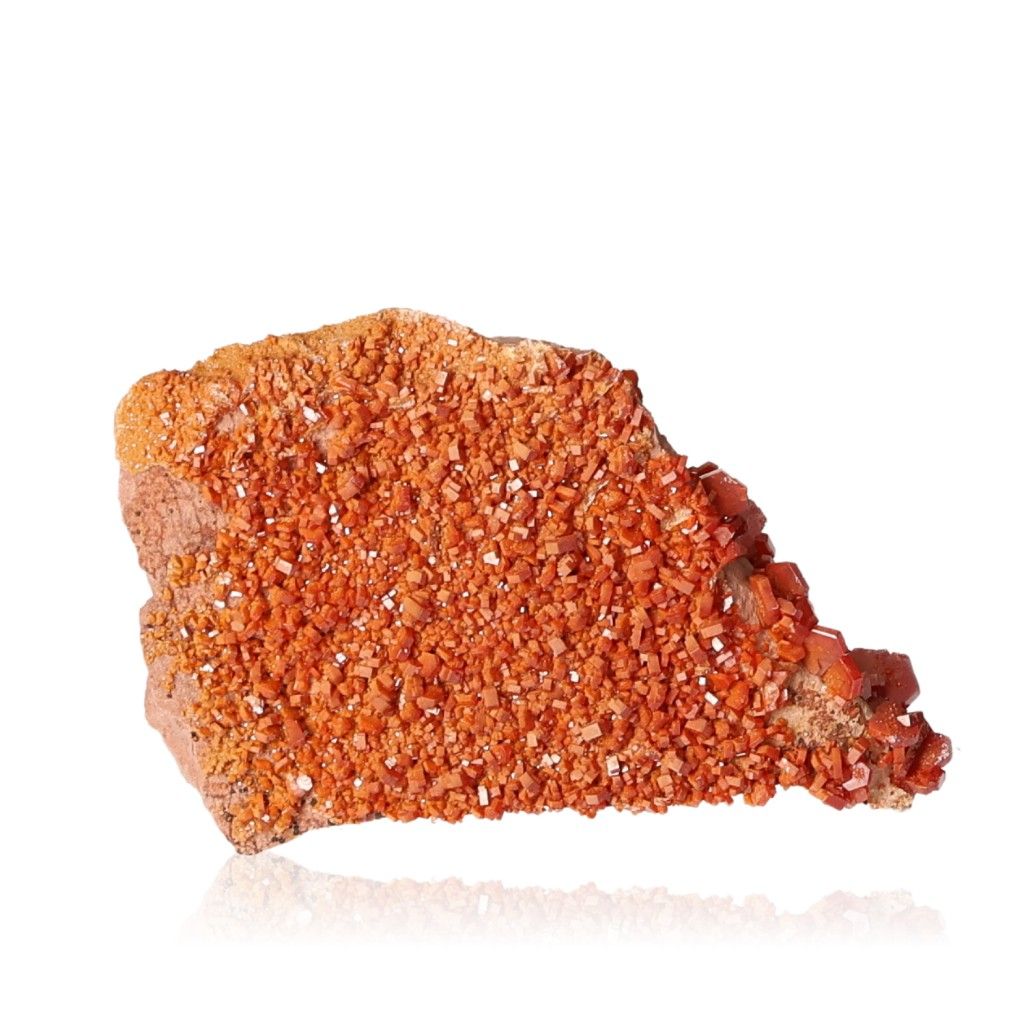 Vanadinite Druze with hexagonal crystals, vibrant orange hues, and glassy surface, enhancing focus and motivation.