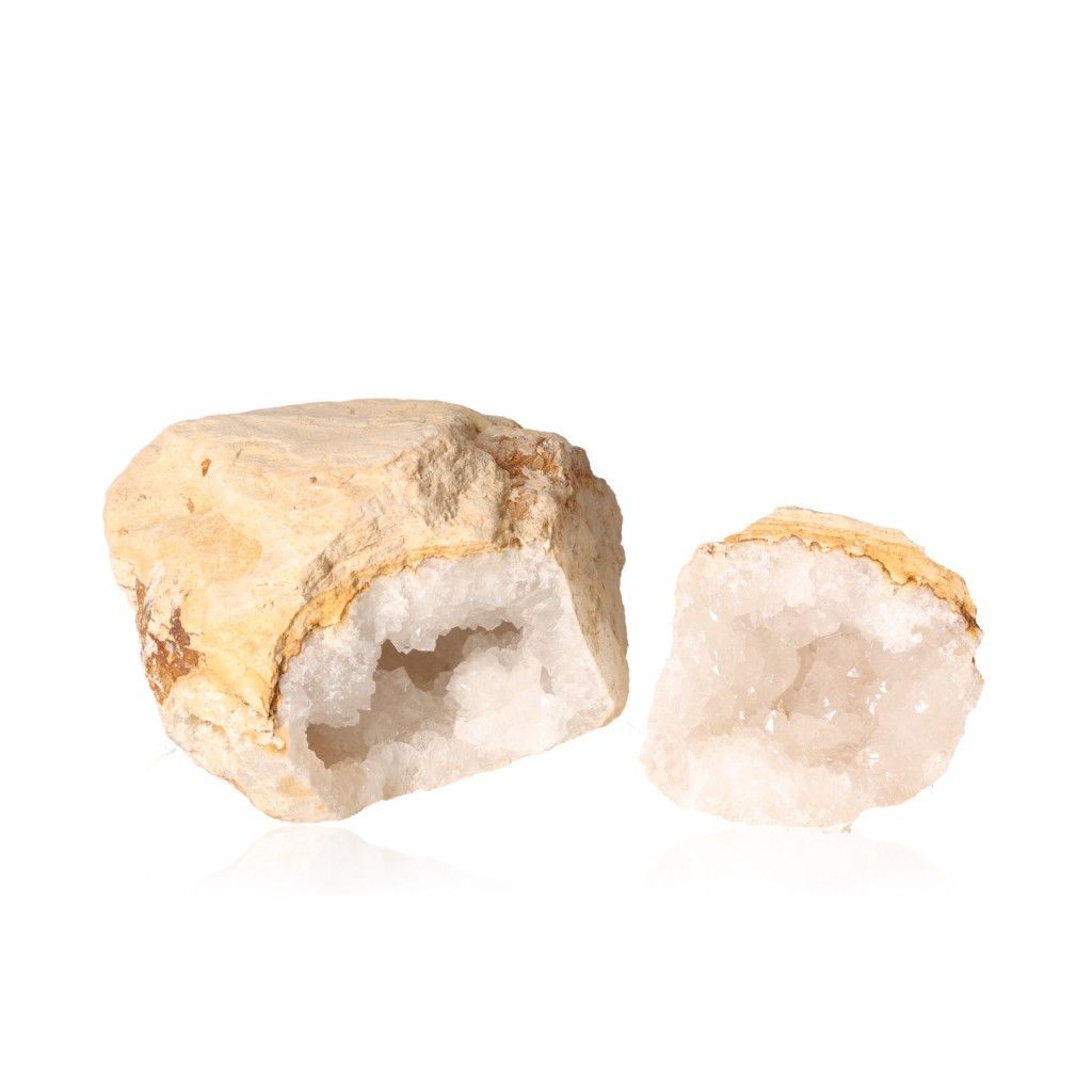 Milky quartz geode with rugged shell and sparkling white crystals, known for purifying energy and enhancing clarity and focus.