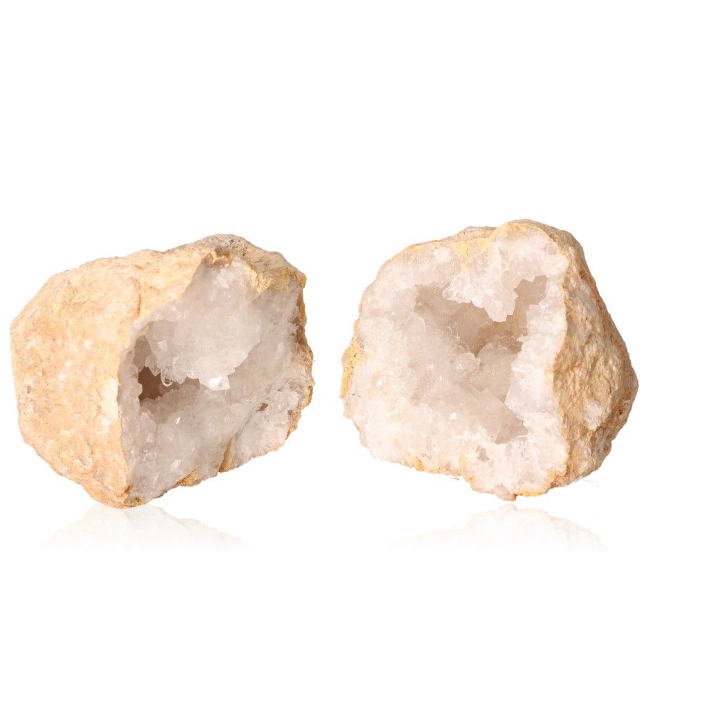 Pair of open quartz geodes showcasing crystal interiors, each weighing 700-900g, known for energetic and spiritual properties.