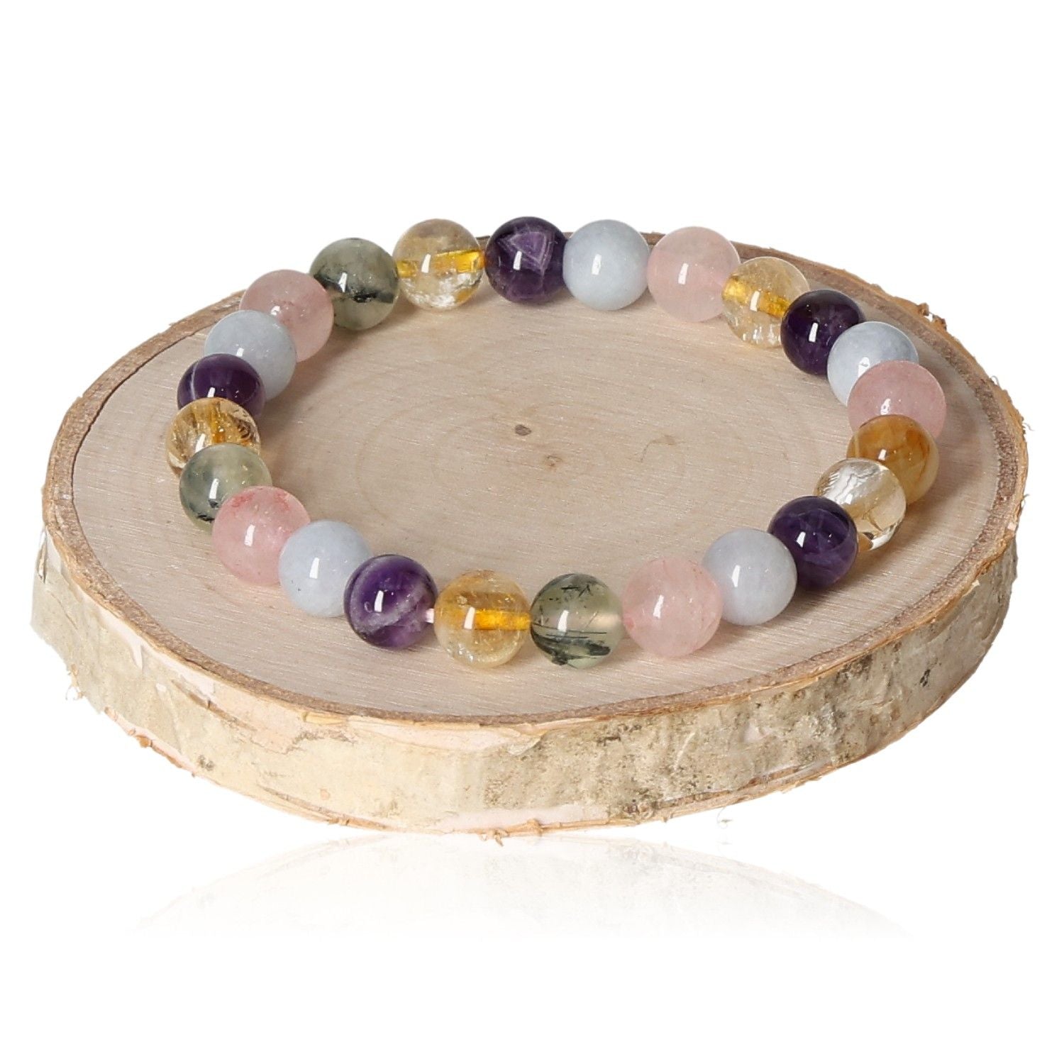 Rose Quartz, Amethyst, and Citrine 8mm gemstone bracelet displayed on a wooden disc.