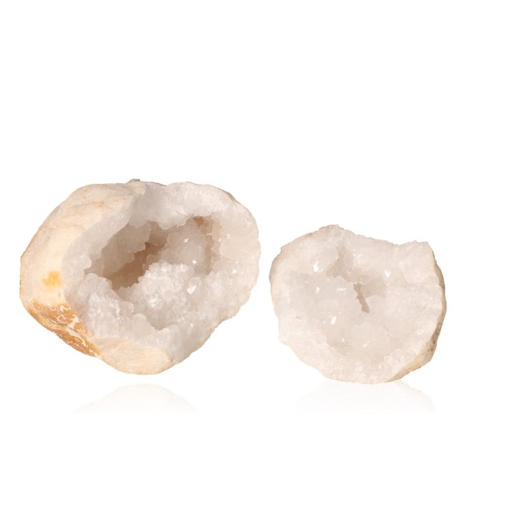 Milky quartz geode split open, revealing sparkling cloudy white crystals for energy cleansing and balance.