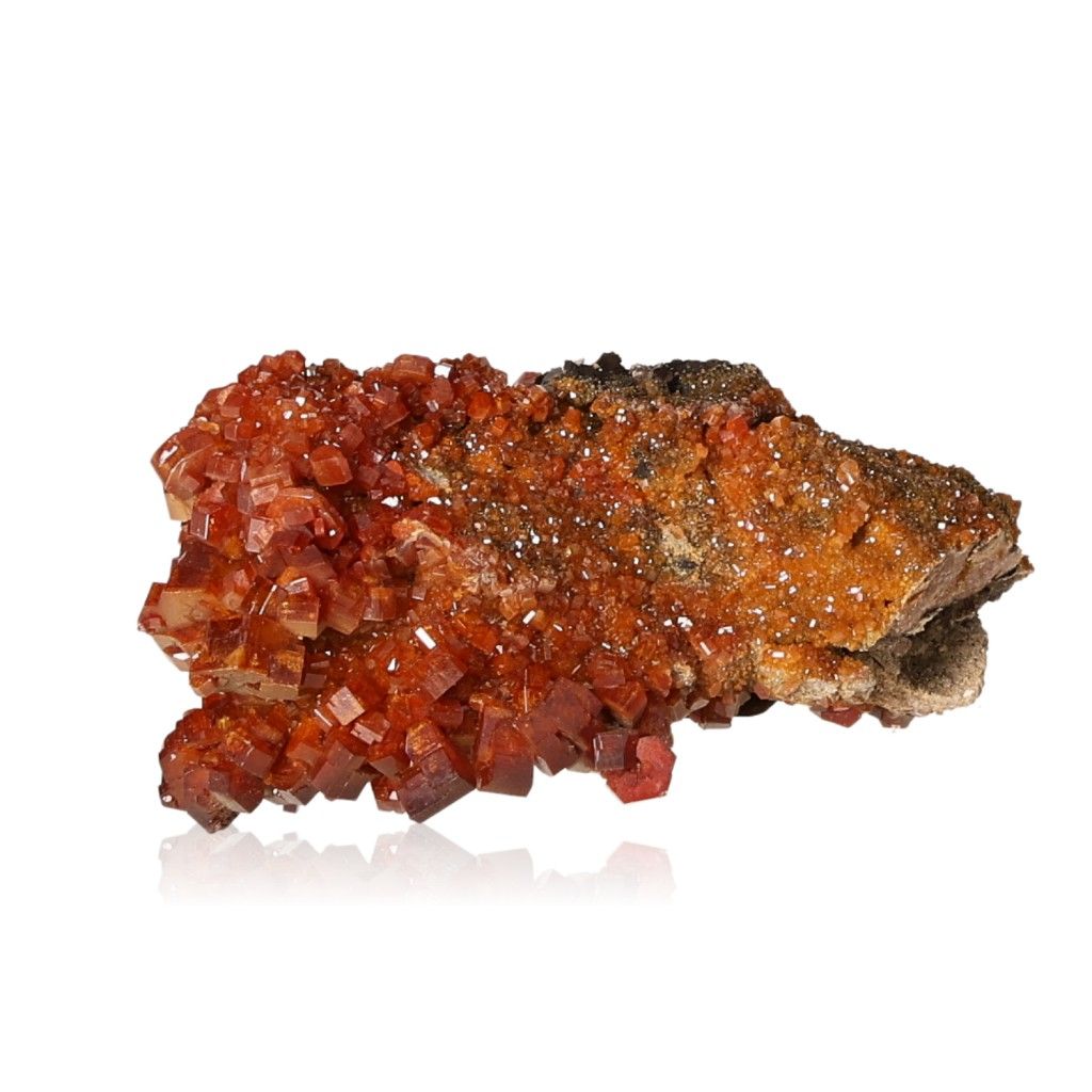 Reddish-orange vanadinite druze with hexagonal crystals and a glassy surface, known for enhancing focus and motivation.