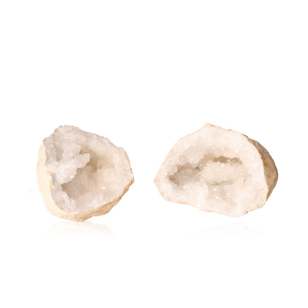 Milky quartz geode with rugged shell and sparkling white crystals, known for purifying energy and enhancing tranquility and clarity.