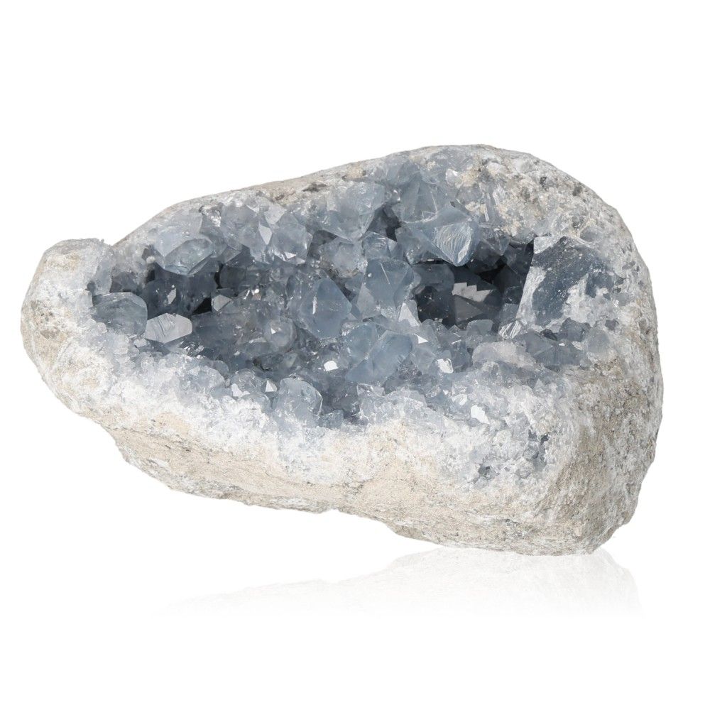 Celestite crystal cluster showcasing calming blue hues and rough stone texture for serenity and divine connection.