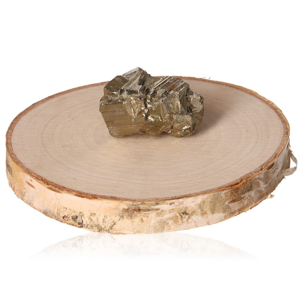 Pyrite druze displayed on a wooden slice, symbolizing courage and motivation for achieving goals.