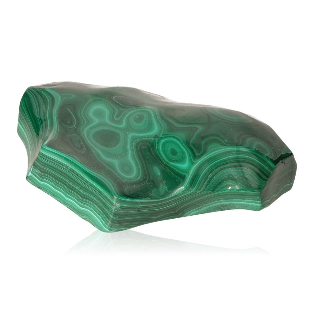 Polished malachite stone with vibrant green bands, symbolizing nature's soothing energy and promoting courage and optimism.