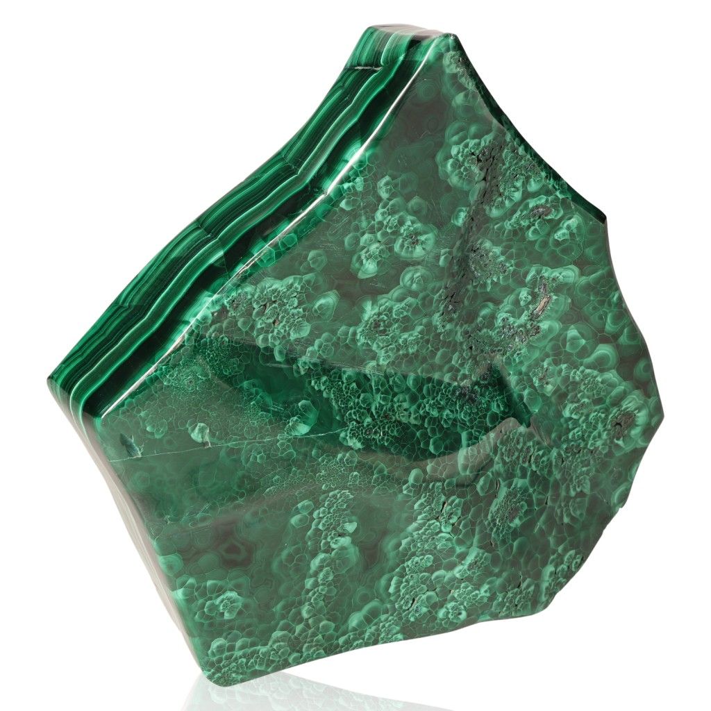 Polished green malachite stone displaying rich textures and layers.