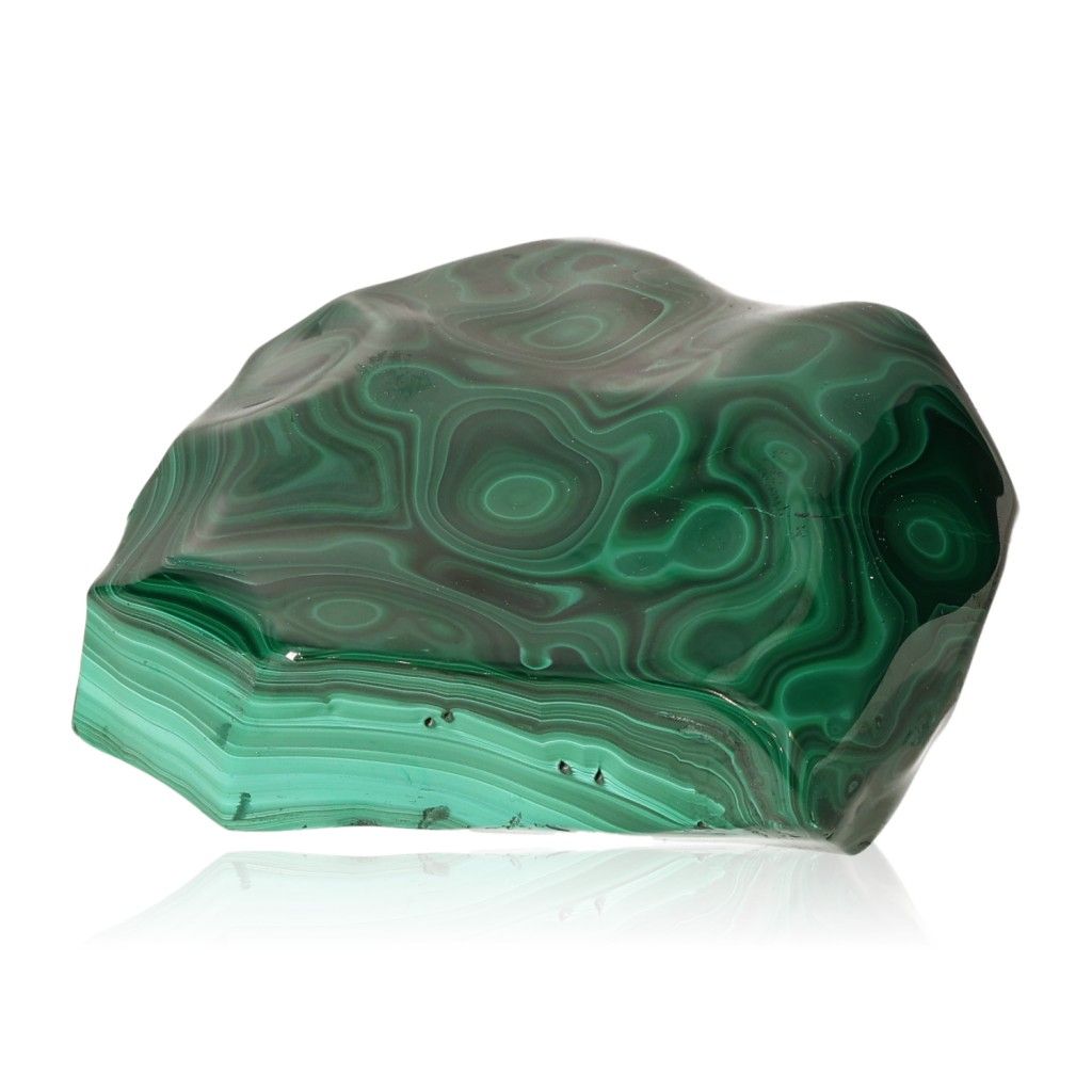 Natural malachite gemstone with vibrant green swirls symbolizing soothing energy and inner harmony.