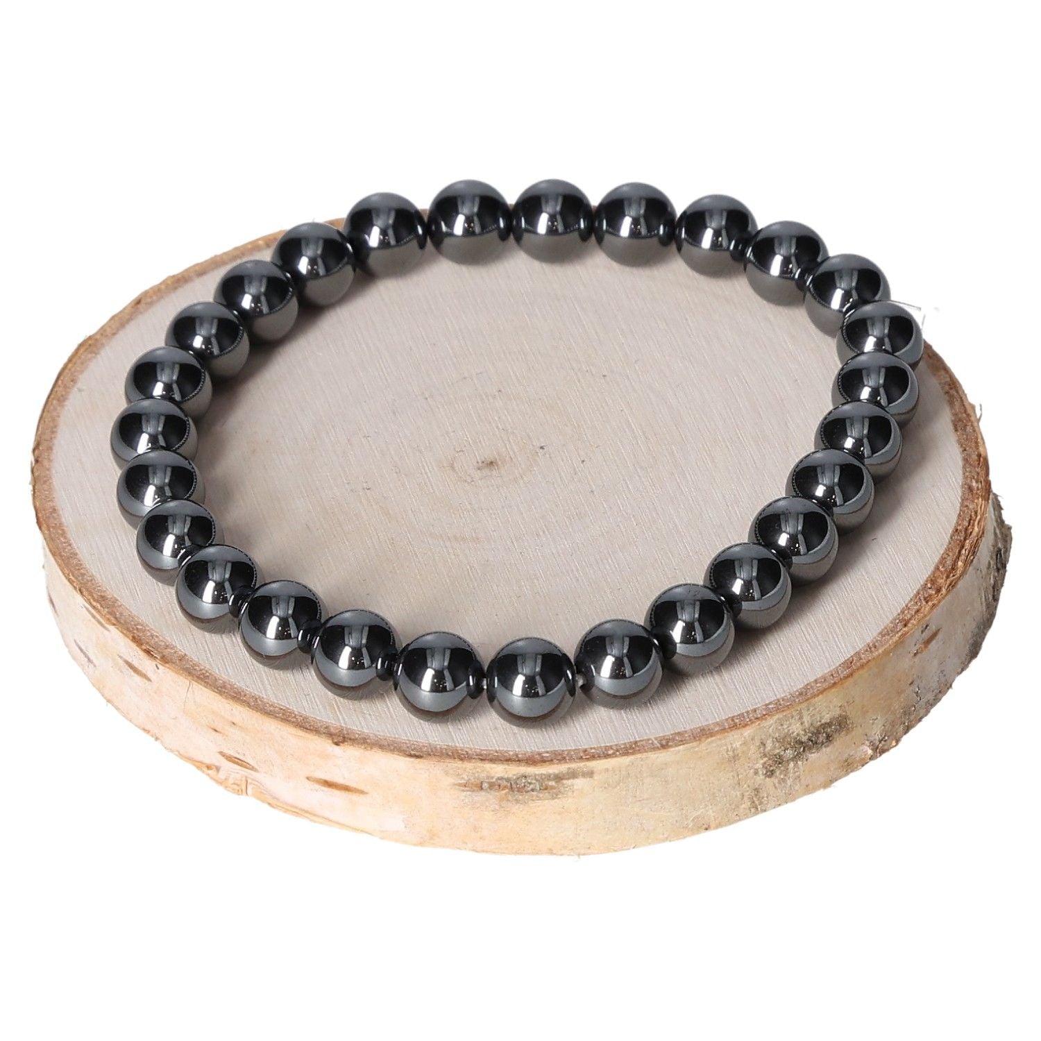 Hematite bracelet for men with 8mm beads displayed on a wooden surface.