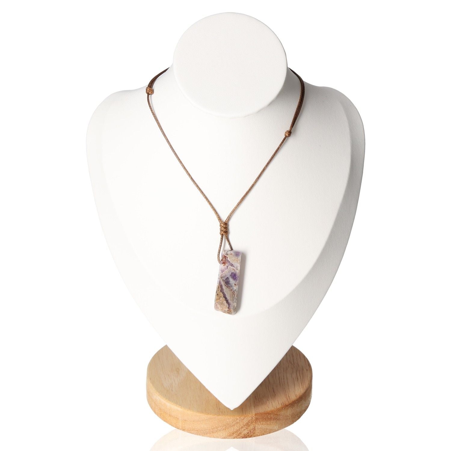 Boho necklace with amethyst pendant on display stand, showcasing elegant and bohemian style.