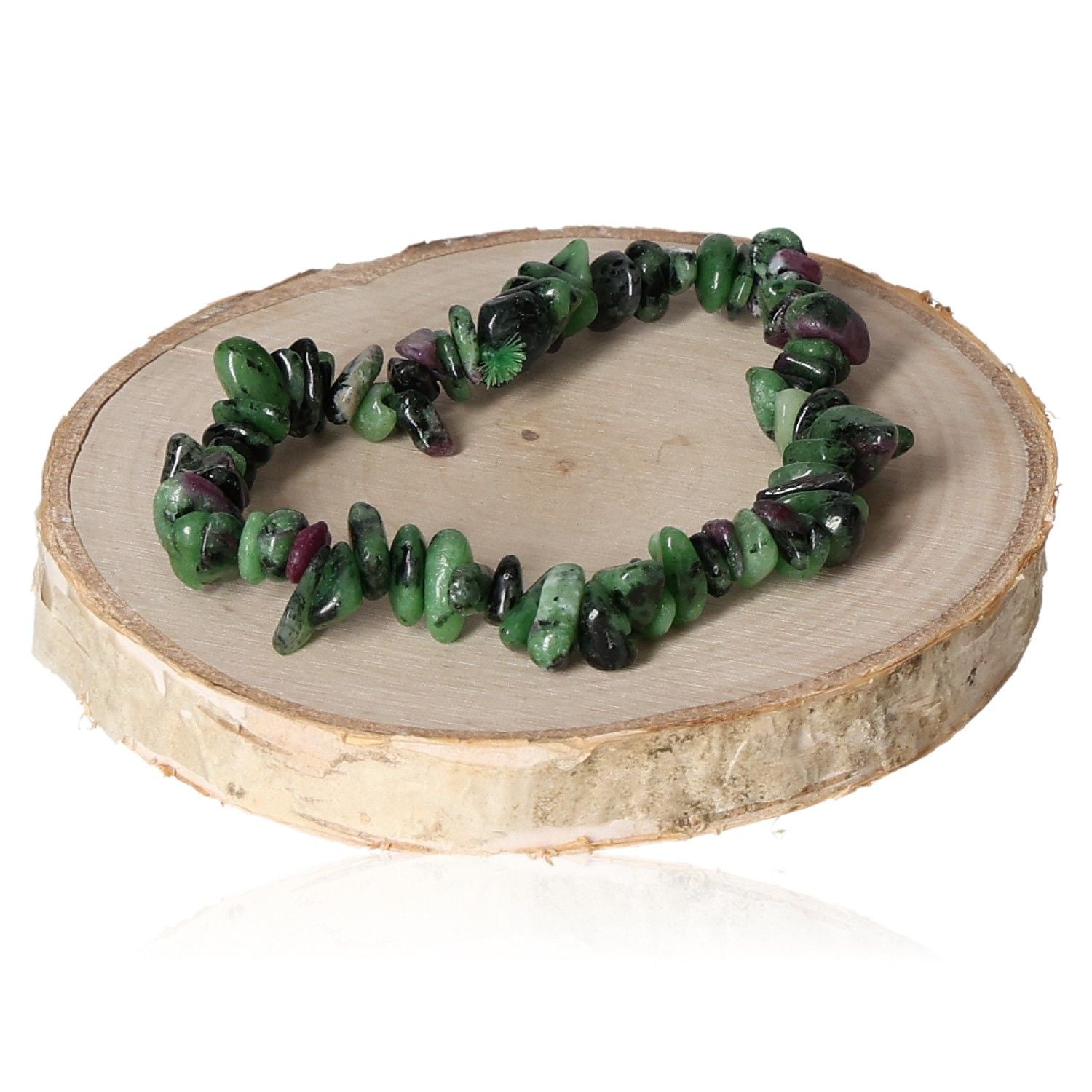 Ruby zoisite chip bracelet on wooden display stand, featuring vibrant green and red stones.