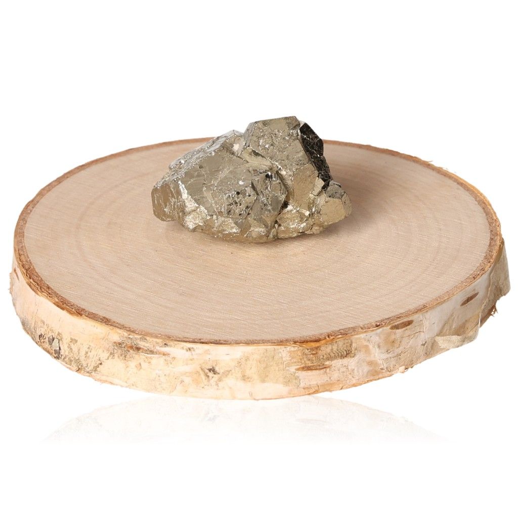 Raw pyrite druzy stone on wooden display, enhances independence and courage