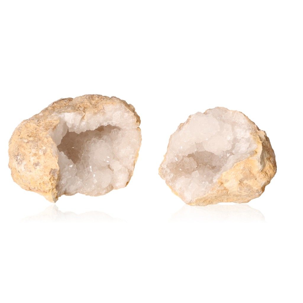 Milky quartz geode with a rugged shell revealing sparkling white crystals, known for enhancing tranquility and energy balance.