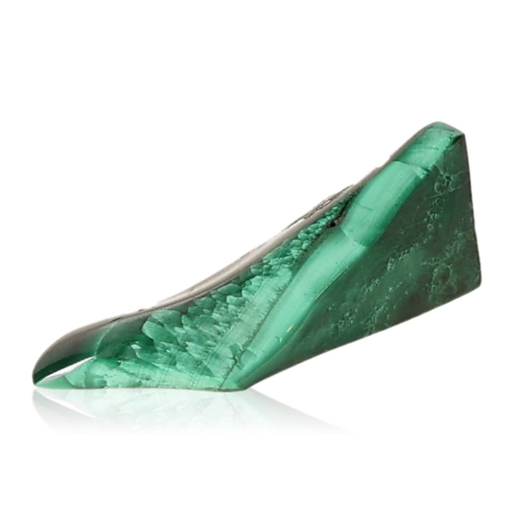 Polished green malachite stone angled on a white background, showcasing its natural patterns and vibrant color.