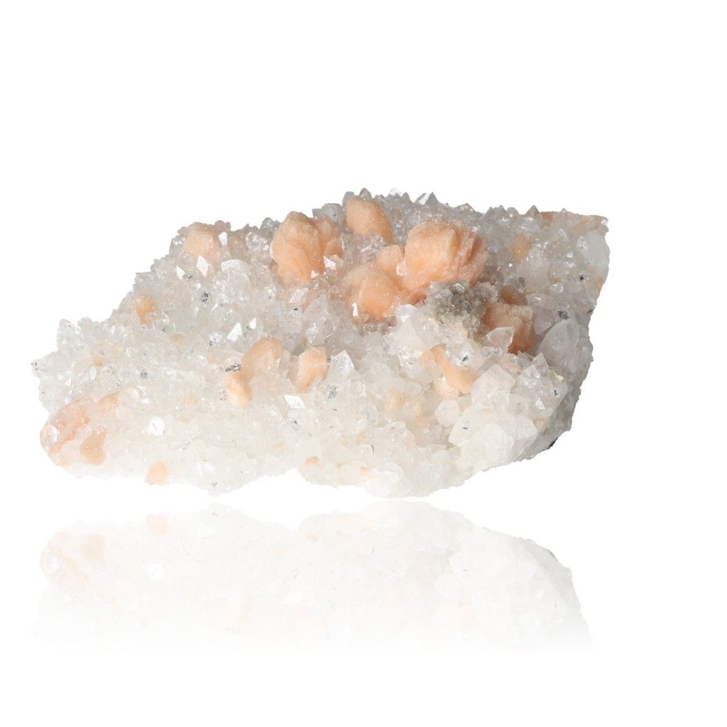 Apophyllite gemstone cluster with sparkling clarity and peach accents, promoting spiritual awakening and mental clarity.