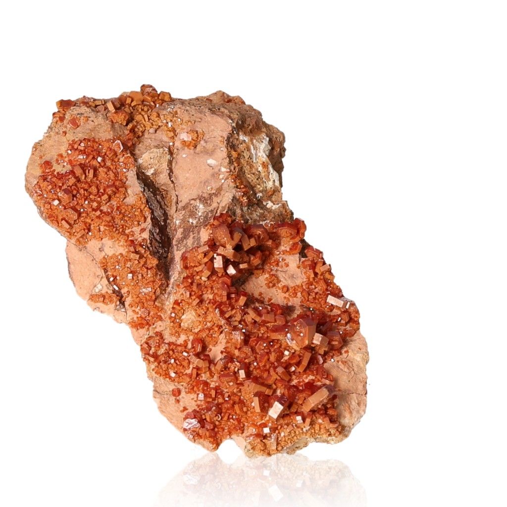 Vanadinite druzy mineral specimen with vibrant hexagonal crystals, showcasing reddish-brown hues and a glassy surface.