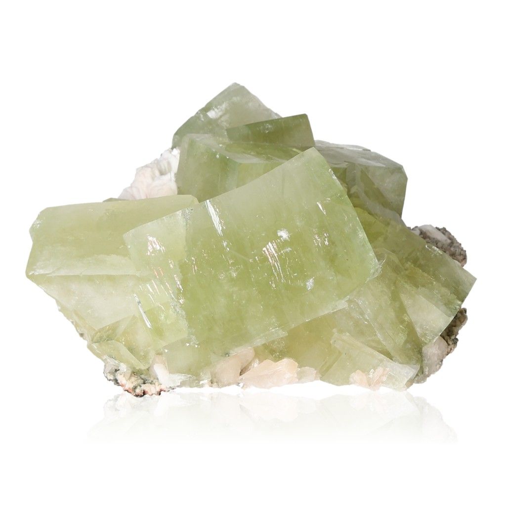 Green apophyllite crystal cluster showcasing clarity, connection, and spiritual awakening properties on a white background.