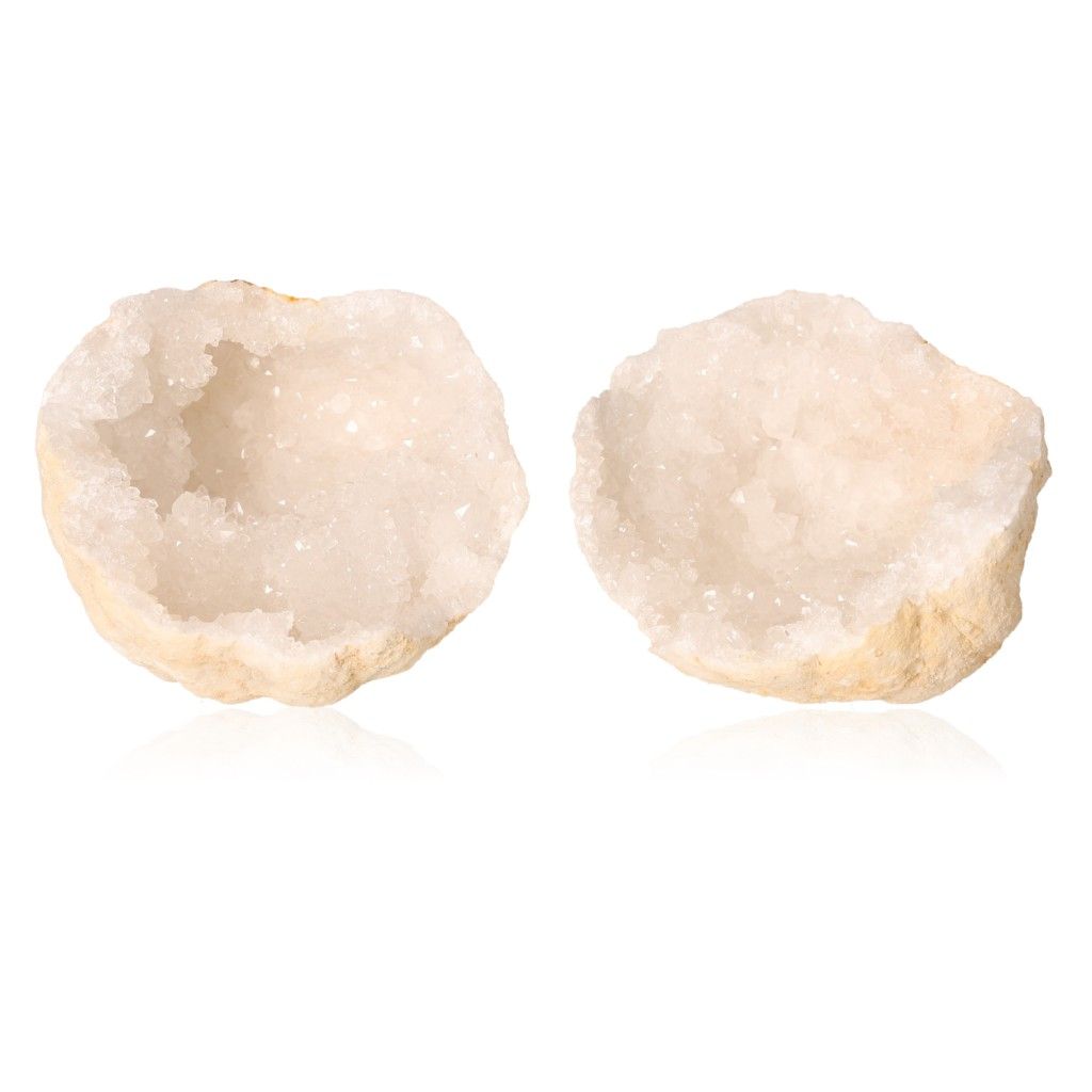 Milky quartz geodes with sparkling white crystals, known for purifying energy and enhancing tranquility and focus.