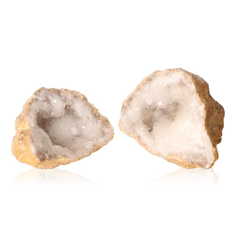 Milky quartz geode with sparkling, cloudy white crystals and rugged outer shell, known for purifying and amplifying energy.