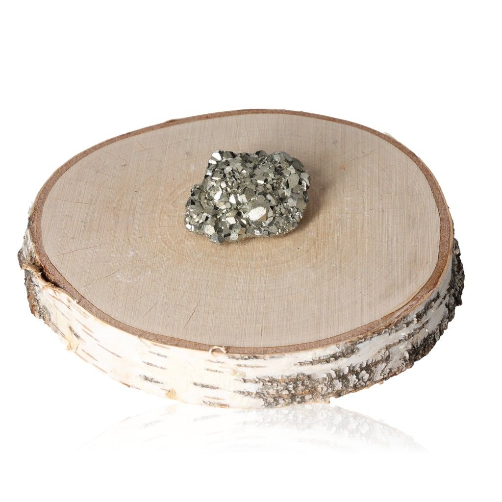 Pyrite druze on a wooden slab, enhancing independence and motivation.