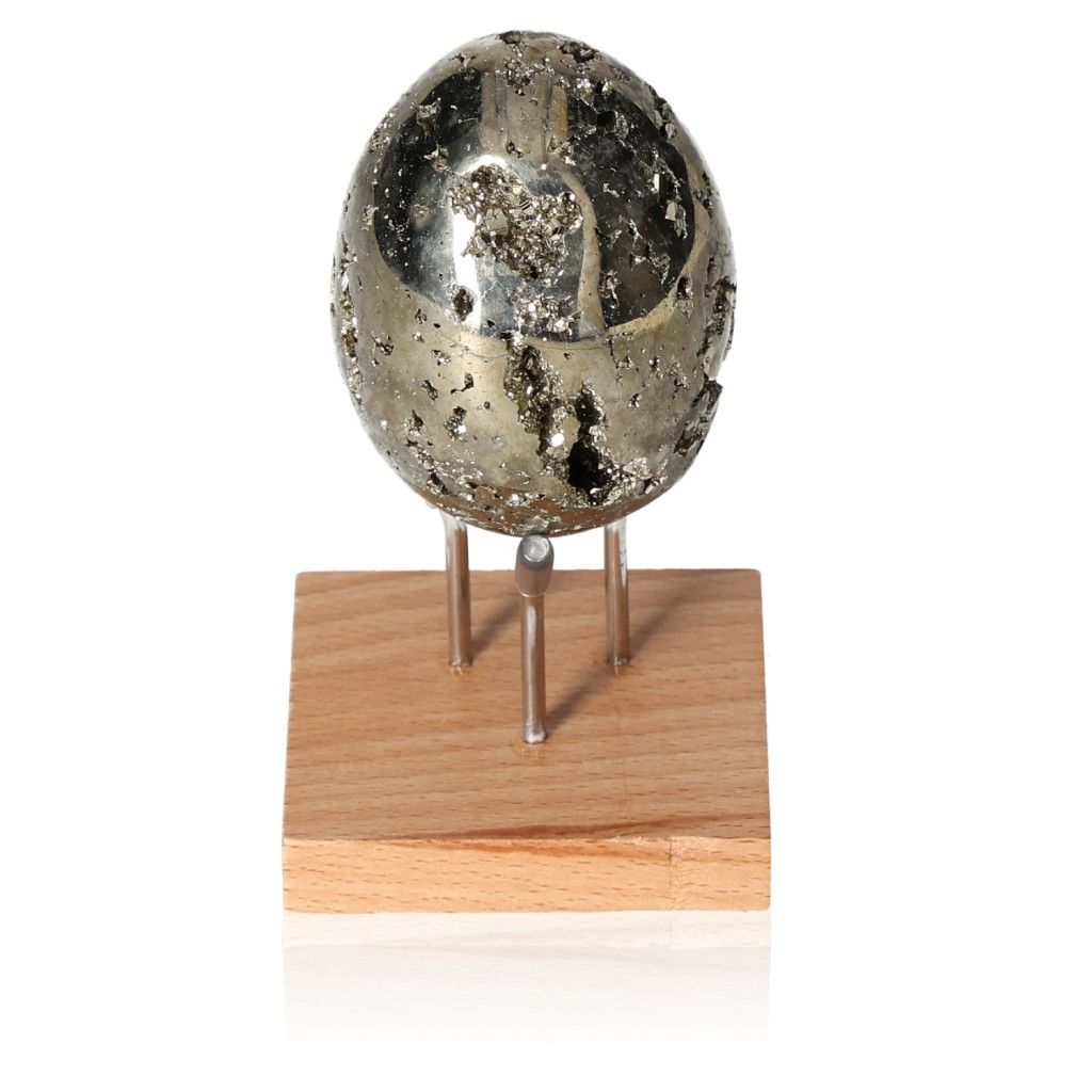 Pyrite egg on wooden stand, supporting independence and courage, ideal for inspiring new ideas and motivating action.