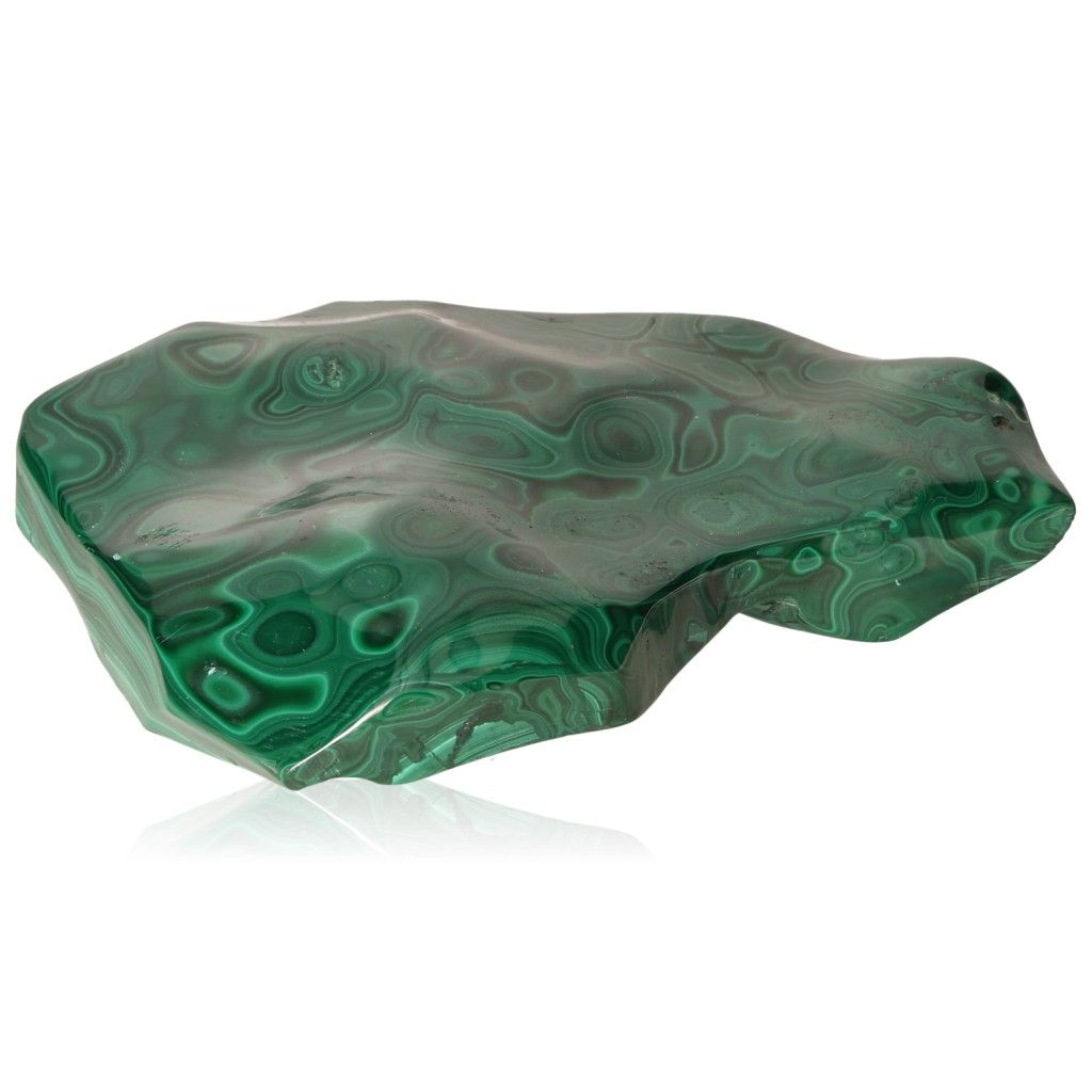 Polished malachite stone with vibrant green swirling patterns, symbolizing nature's soothing and energizing qualities.