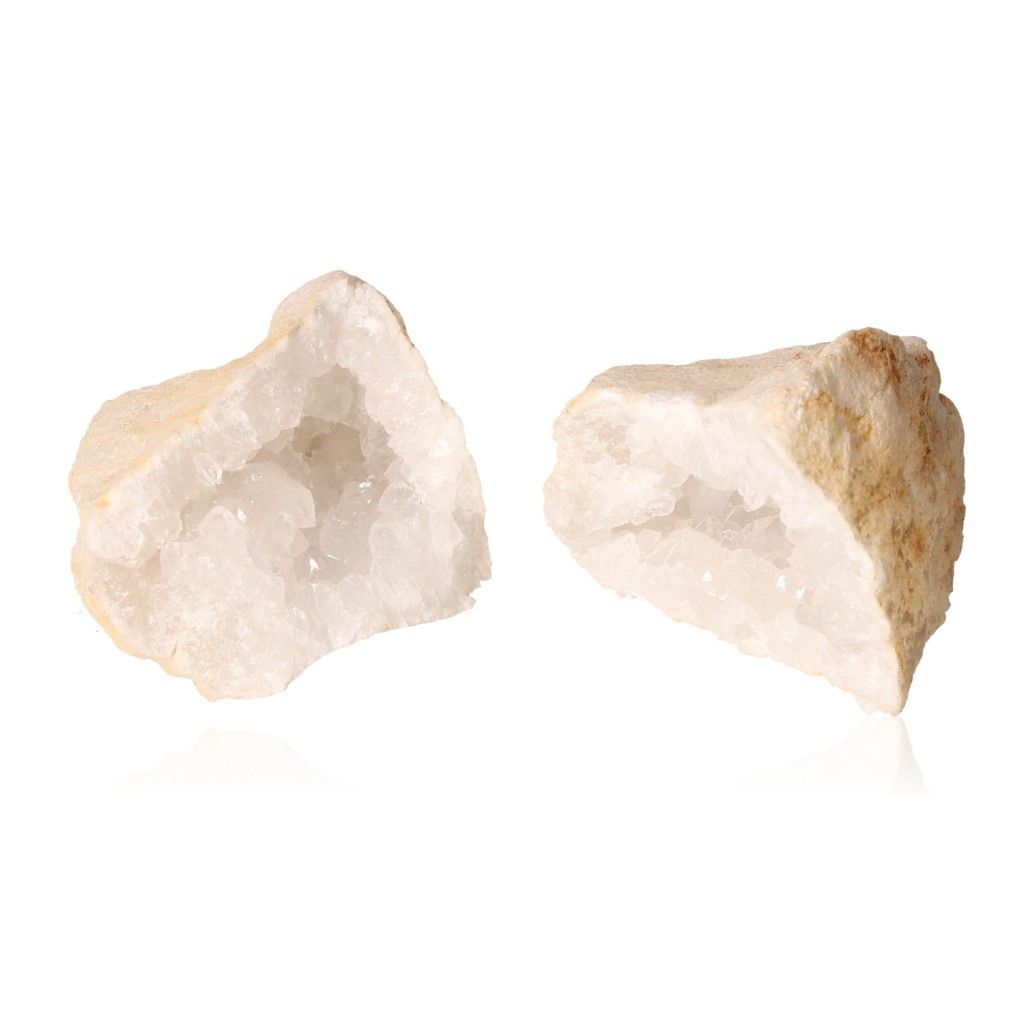 Milky quartz geode halves showing sparkling white crystals and rugged outer shell, ideal for energy cleansing and enhancing focus.