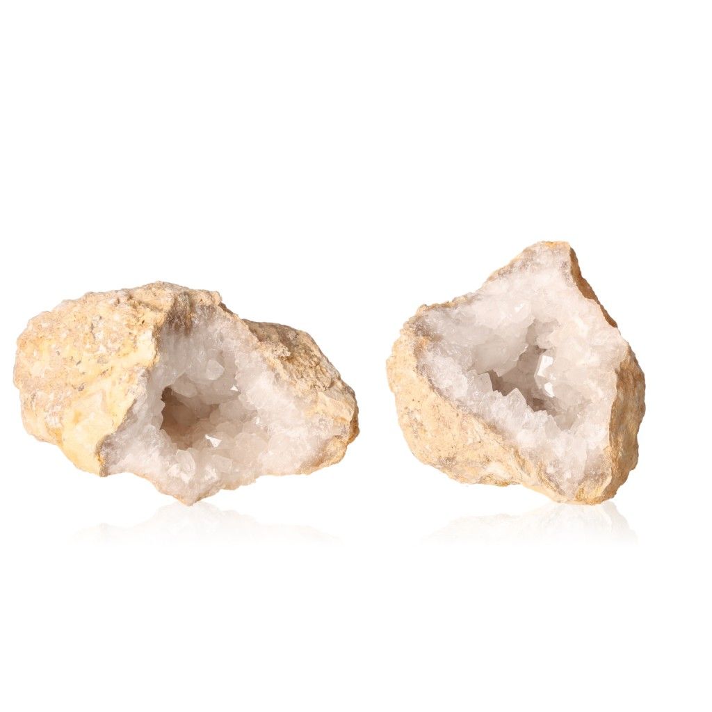 Milky quartz geodes with rugged shells revealing sparkling white crystals, perfect for energy balancing and enhancing tranquility.