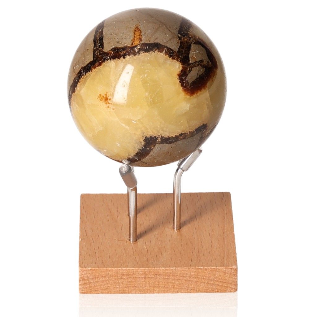 Septarian Sphere on wooden stand, showcasing unique dragon stone patterns, symbolizing power and endurance.