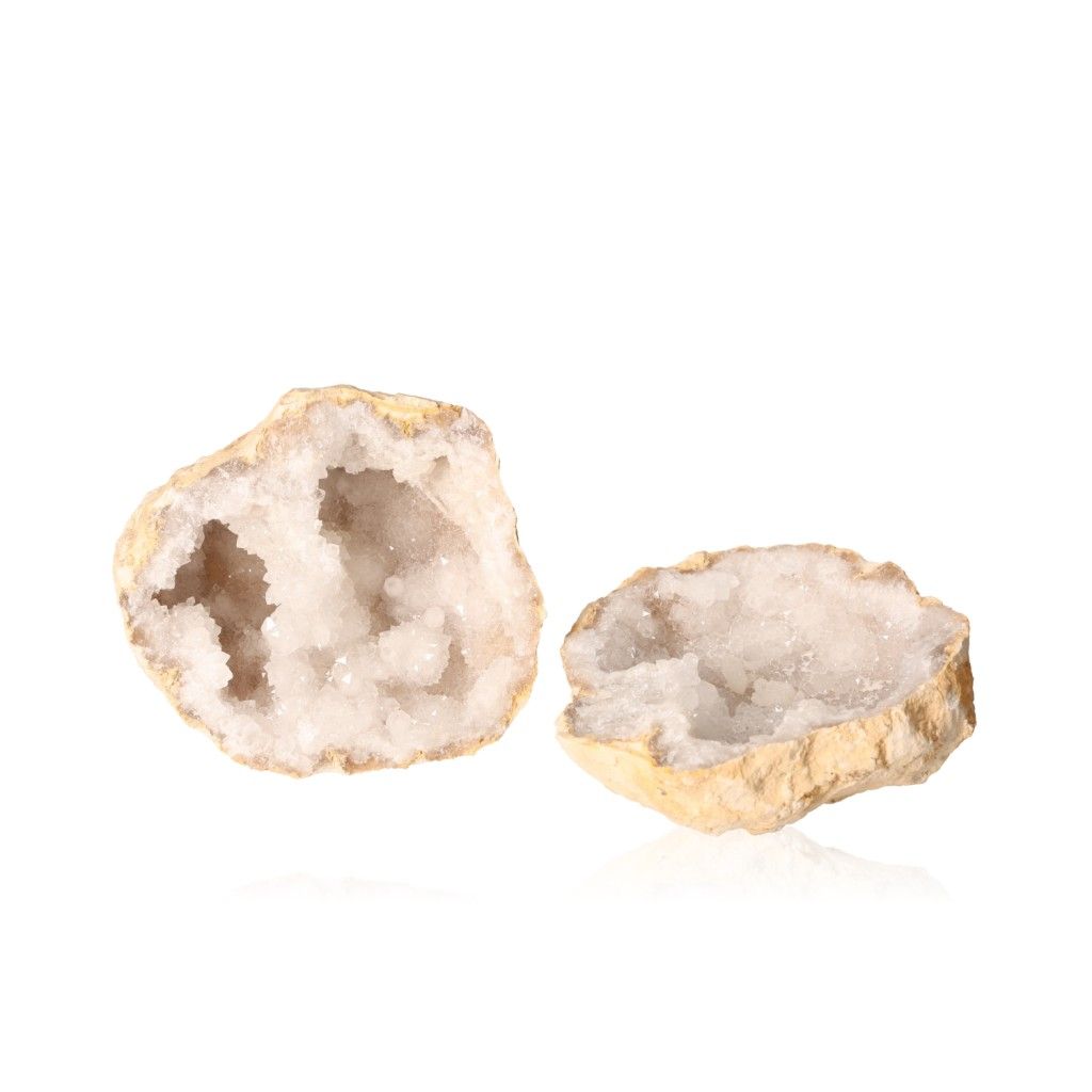 Quartz geode with rugged shell and sparkling white crystals, perfect for energy balance and tranquility.