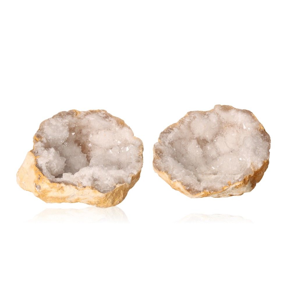 Milky quartz geodes with sparkling white crystals for energy balance and clarity.